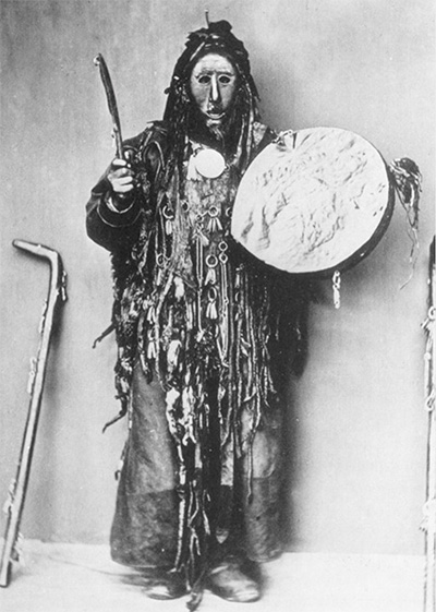 Buryat shaman beating drum to induce altered consciousness.