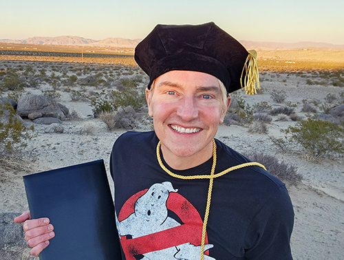 Scotch Wichmann receiving doctorate in parapsychology