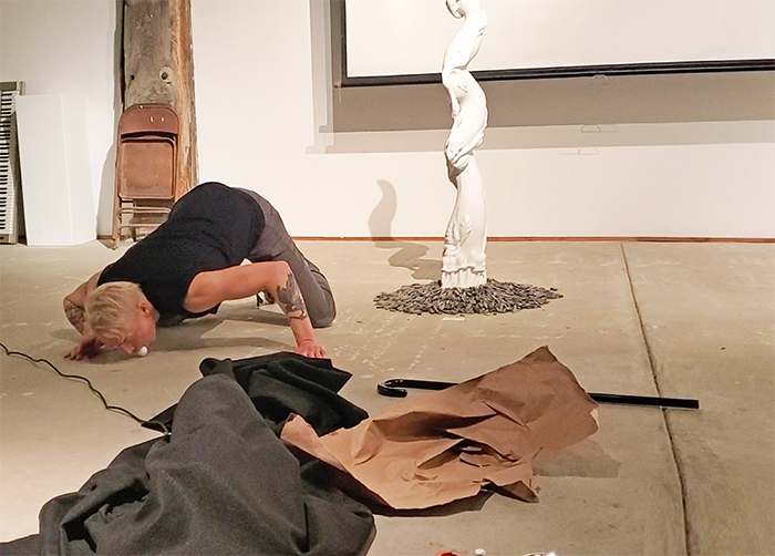 Scotch Wichmann performing a shamanic performance art piece called John's Arrow, Ventura, CA, 2019