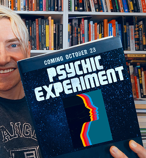 Photo of Scotch Wichmann holding ad for the Psychic Experiment that launches October 23, 2022